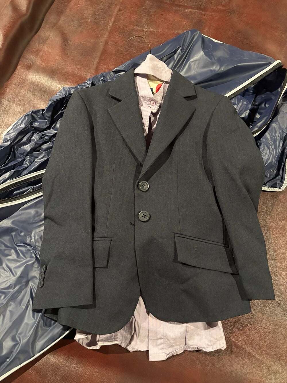 Blazer, long sleeve dress shirt, riding pants, belt, and cover for tops